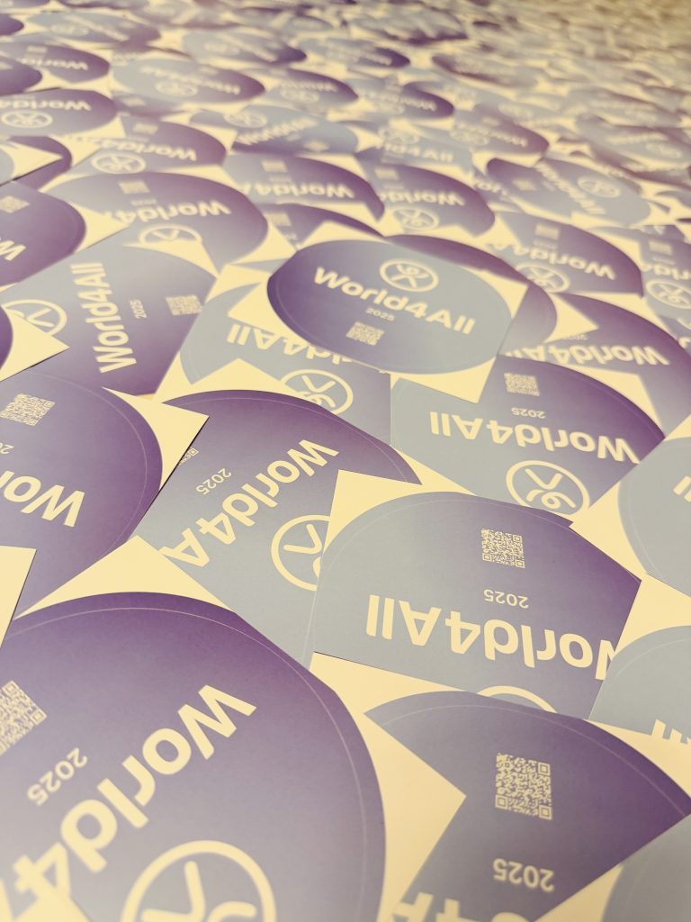 World4All 2025 stickers with logo and QR code ready for an event dedicated to accessibility.